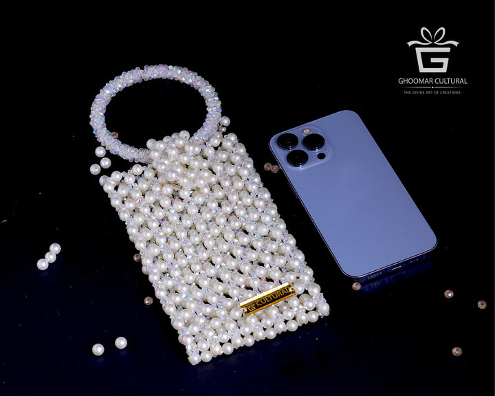 Add a touch of timeless elegance with our Handcrafted White Crystal & Pearl Mobile Pouch. Designed to fit all phone sizes, this party-perfect clutch features dazzling crystals and delicate pearls—ideal for weddings, festive occasions, and stylish evenings out.