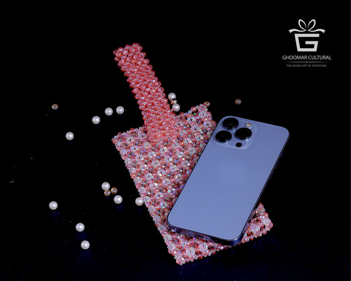 Turn heads with our Handcrafted Blush Pink Crystal Mobile Clutch – a perfect blend of sparkle and sophistication. Adorned with shimmering crystals and designed to fit all phone sizes, this elegant party wear purse adds a touch of glam to weddings, festive events, and special occasions