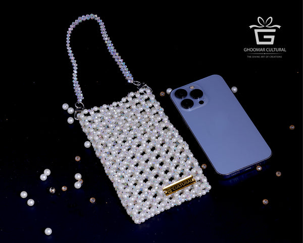 Add a touch of grace to your look with our White Crystal Pearl Mobile Pouch. Handcrafted with shimmering crystals and classic pearls, this elegant clutch fits all phone sizes and is perfect for weddings, festive events, or evening outings. A timeless accessory that blends beauty and function.