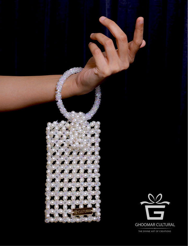 Add a touch of timeless elegance with our Handcrafted White Crystal & Pearl Mobile Pouch. Designed to fit all phone sizes, this party-perfect clutch features dazzling crystals and delicate pearls—ideal for weddings, festive occasions, and stylish evenings out.